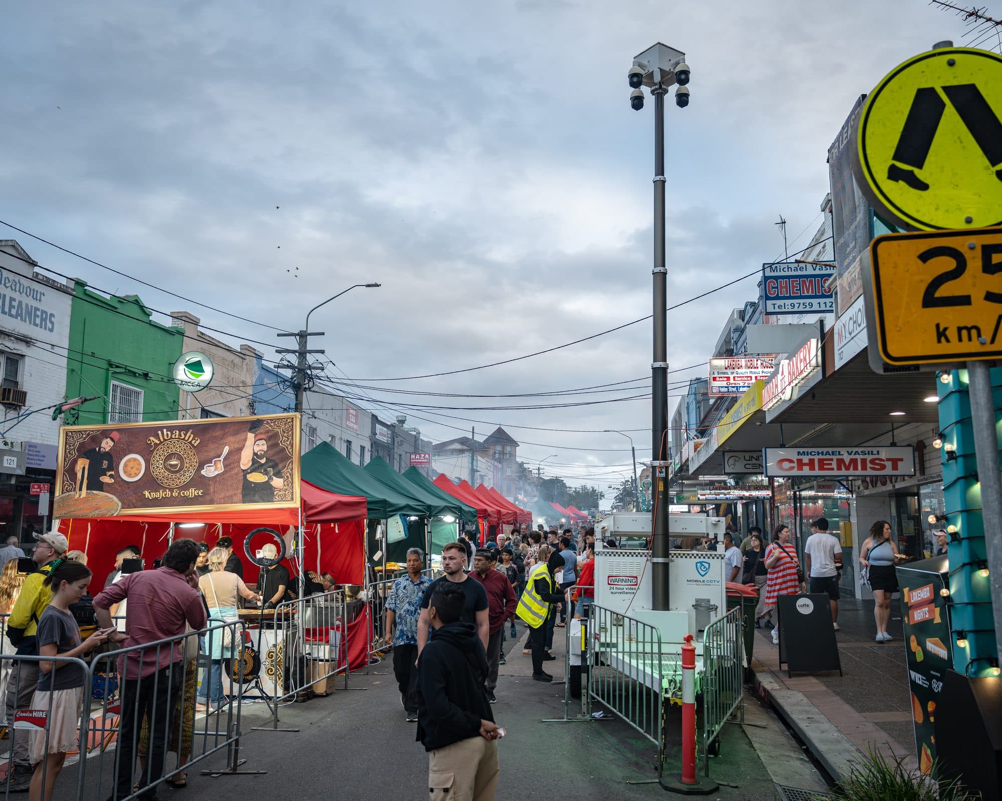 Ramadan Nights market crowd on Haldon Street, Lakemba, with a Mobile CCTV Solutions camera tower overlooking the street