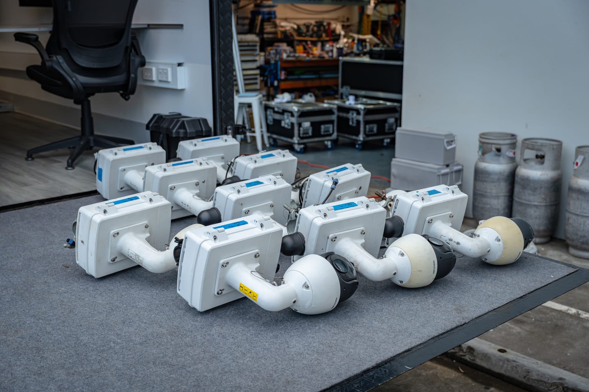 Pole camera units staged on a mat ready for the TCS Sydney Marathon deployment