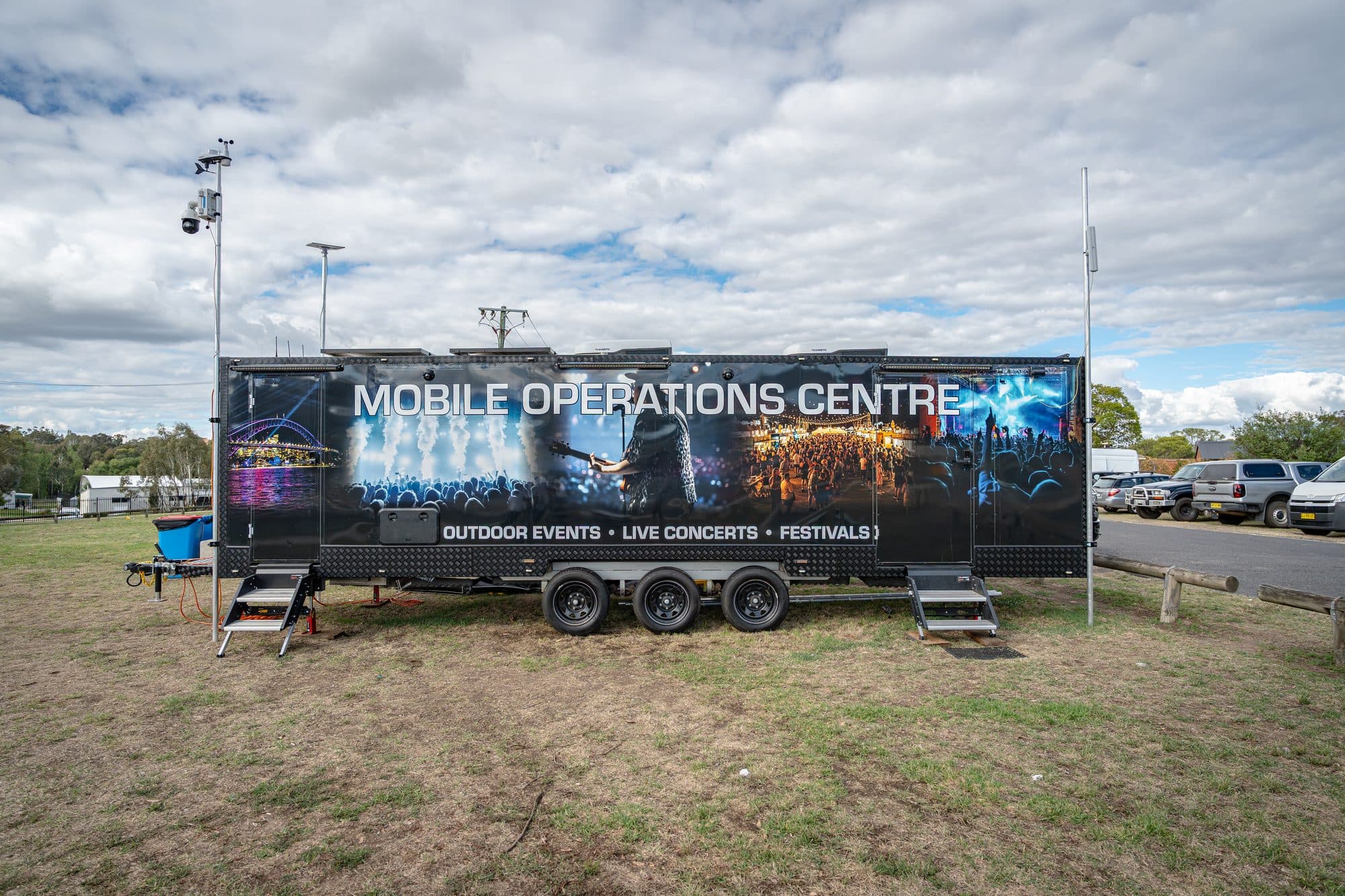 Mobile CCTV Solutions' Mobile Operations Centre trailer, branded for outdoor events, deployed on site