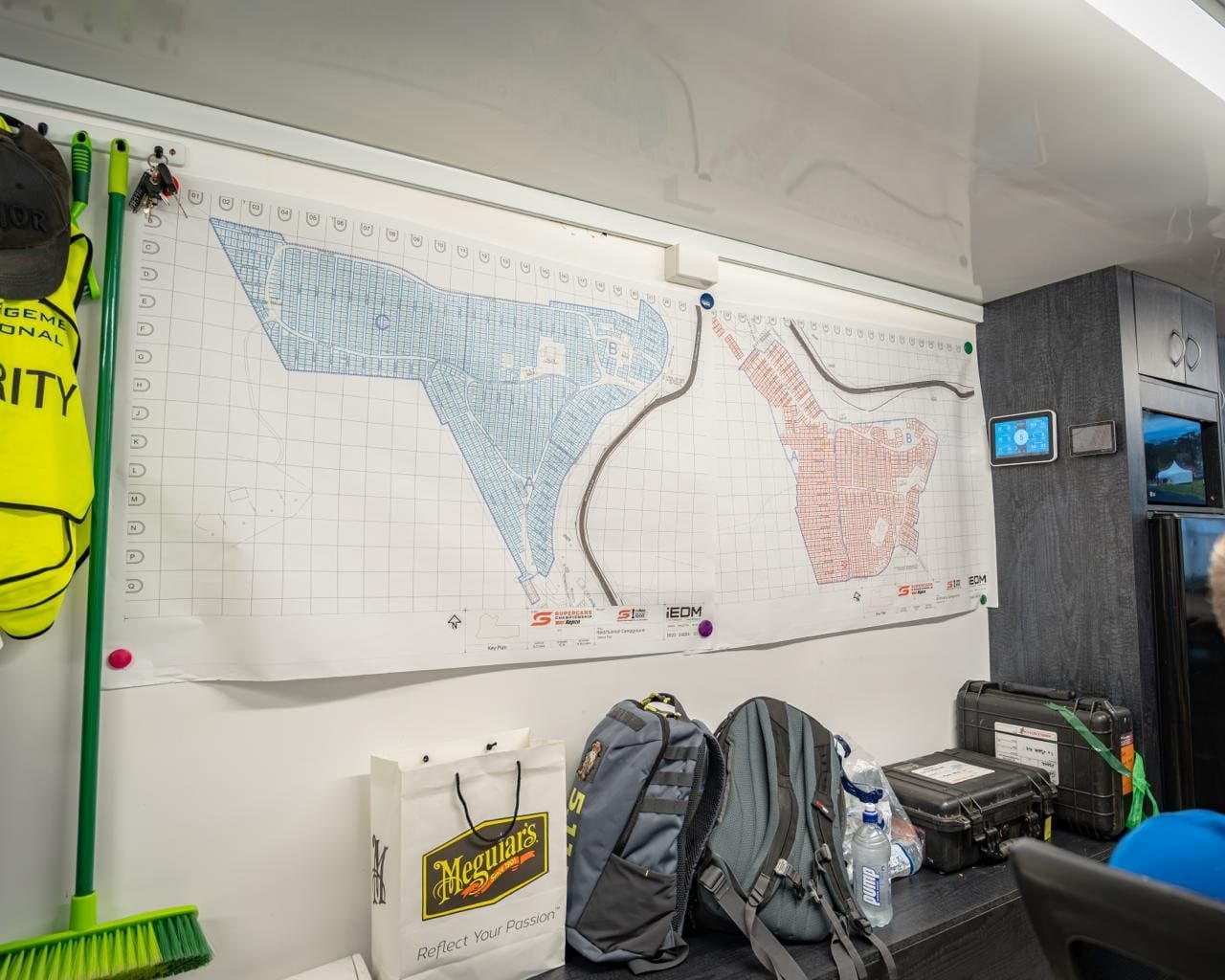 Inside the Mobile Operations Centre: site plans pinned to the wall above the team's equipment
