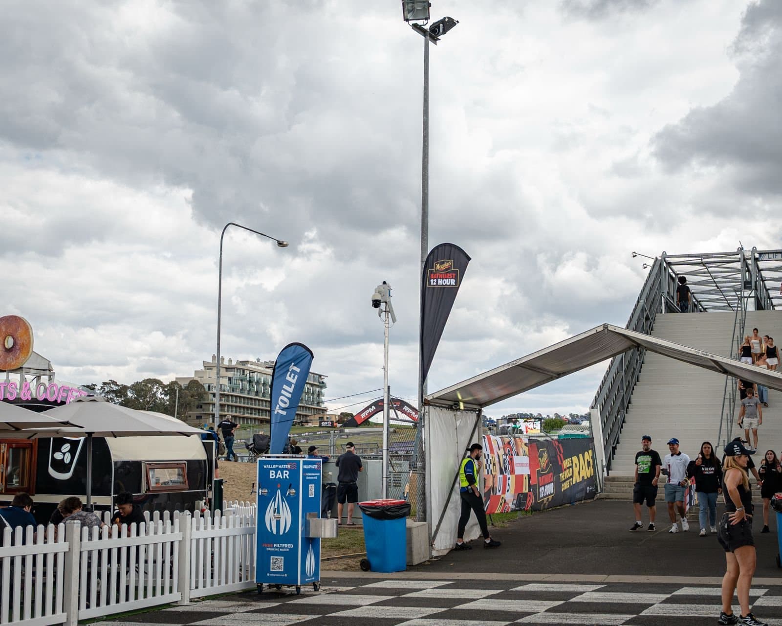 A pole-mounted camera at the entrance to an event